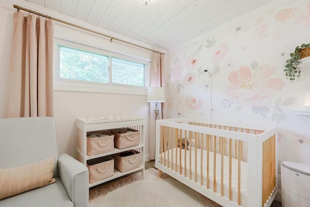 29 Regal St, Holliston, MA 01746 - bedroom featuring wood ceiling, a crib, and wallpapered walls