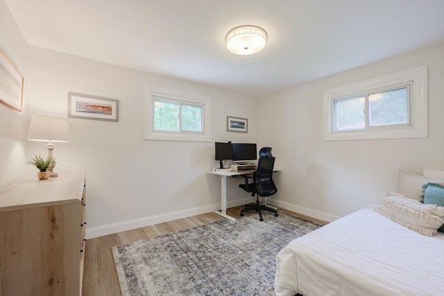 29 Regal St, Holliston, MA 01746 - bedroom with light wood-type flooring, baseboards, and an office area
