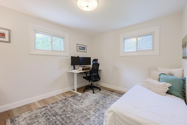 29 Regal St, Holliston, MA 01746 - bedroom with wood finished floors, baseboards, and an office area