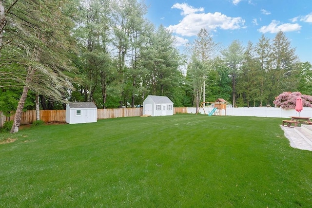 29 Regal St, Holliston, MA 01746 - view of yard with a playground and view of wooded area