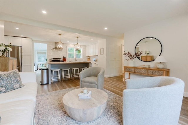 29 Regal St, Holliston, MA 01746 - living area featuring light wood finished floors, recessed lighting, and baseboards