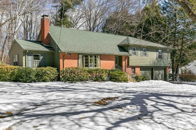 view of front of house featuring brick siding and a chimney