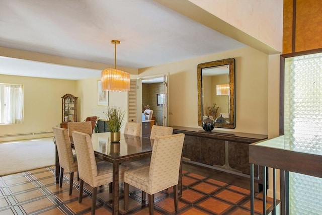 dining room featuring a chandelier and a baseboard radiator