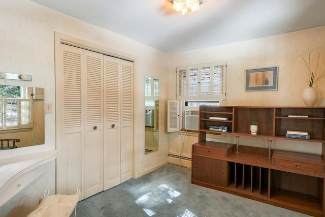 office space featuring carpet floors, lofted ceiling, and wallpapered walls