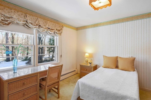 bedroom with a baseboard radiator and light colored carpet