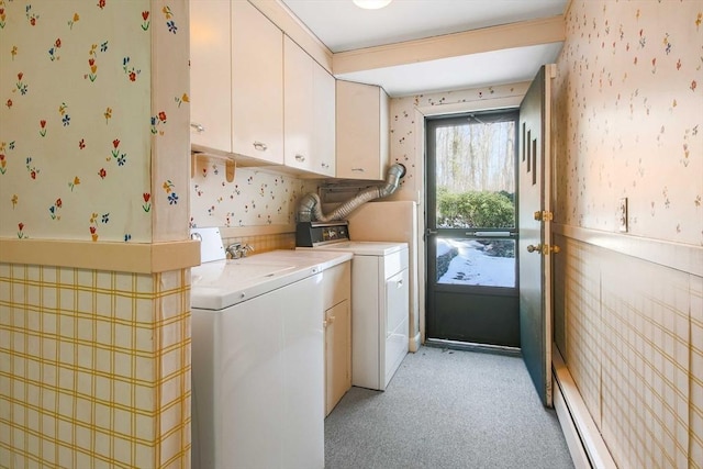 laundry room featuring a baseboard radiator, cabinet space, independent washer and dryer, and wallpapered walls