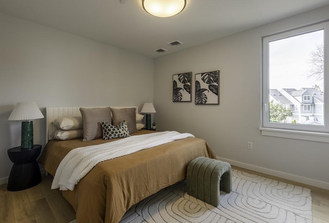 bedroom with light hardwood / wood-style flooring