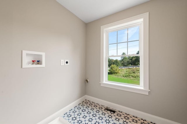 laundry room featuring electric dryer hookup and washer hookup