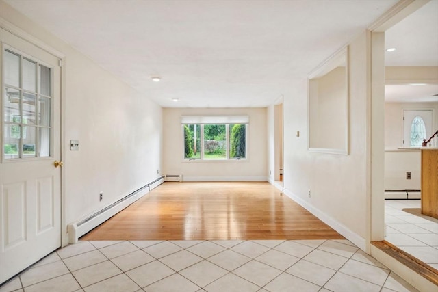 103 Central St, Newbury, MA 01922 - empty room featuring a baseboard radiator and light wood-style floors