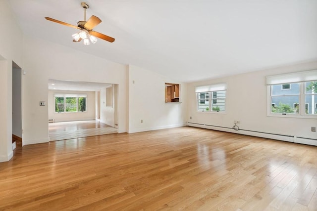 103 Central St, Newbury, MA 01922 - unfurnished living room featuring vaulted ceiling, baseboard heating, light wood-type flooring, a ceiling fan, and a baseboard heating unit