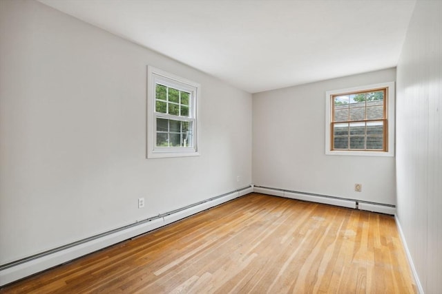 103 Central St, Newbury, MA 01922 - empty room with a baseboard heating unit, wood-type flooring, and a baseboard radiator