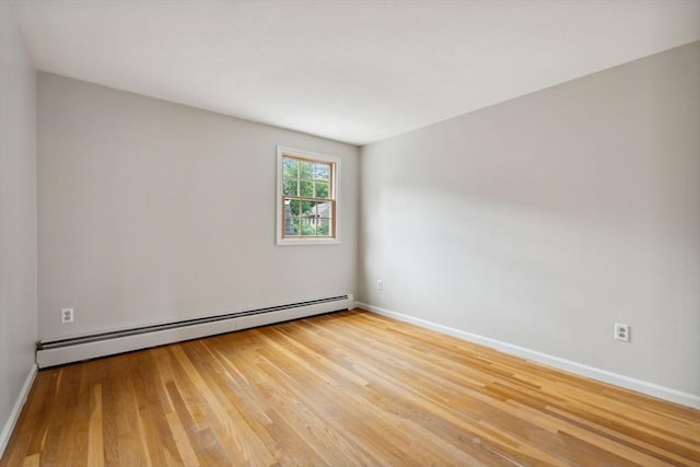 103 Central St, Newbury, MA 01922 - unfurnished room featuring a baseboard radiator and light wood-style floors