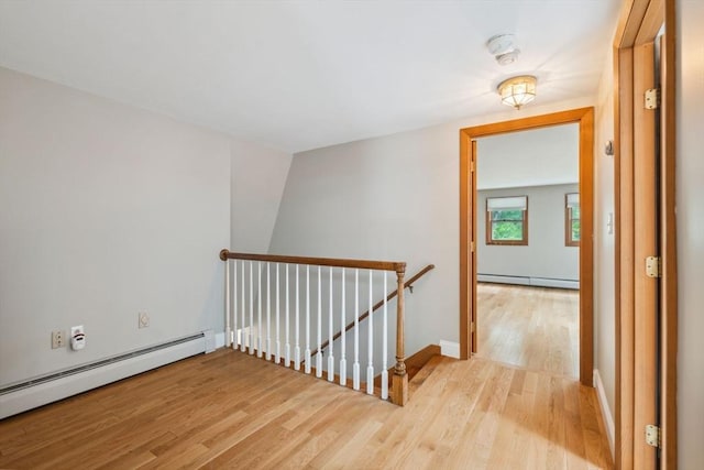 103 Central St, Newbury, MA 01922 - hall with an upstairs landing, a baseboard heating unit, and light wood finished floors