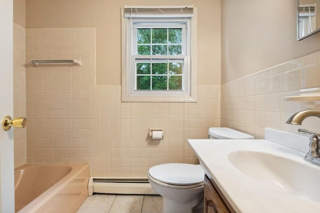 103 Central St, Newbury, MA 01922 - bathroom with a baseboard heating unit, tile walls, vanity, tile patterned flooring, and wainscoting
