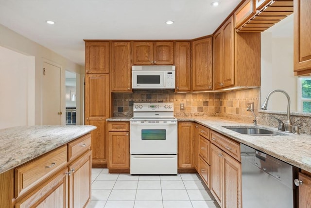 103 Central St, Newbury, MA 01922 - kitchen with white appliances, tasteful backsplash, light stone countertops, light tile patterned floors, and recessed lighting