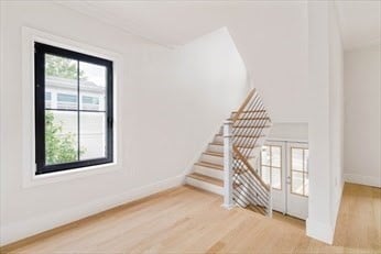 empty room with hardwood / wood-style flooring