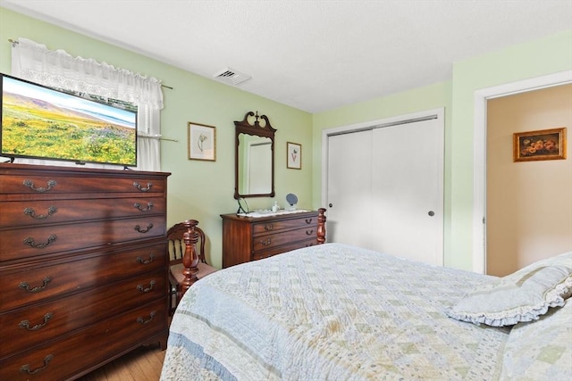 114 Cypress Dr, Swansea, MA 02777 - bedroom featuring a closet and wood finished floors