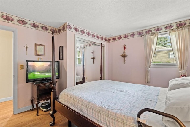 114 Cypress Dr, Swansea, MA 02777 - bedroom featuring light wood-type flooring and a textured ceiling