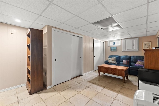 114 Cypress Dr, Swansea, MA 02777 - living room featuring light tile patterned floors and a drop ceiling