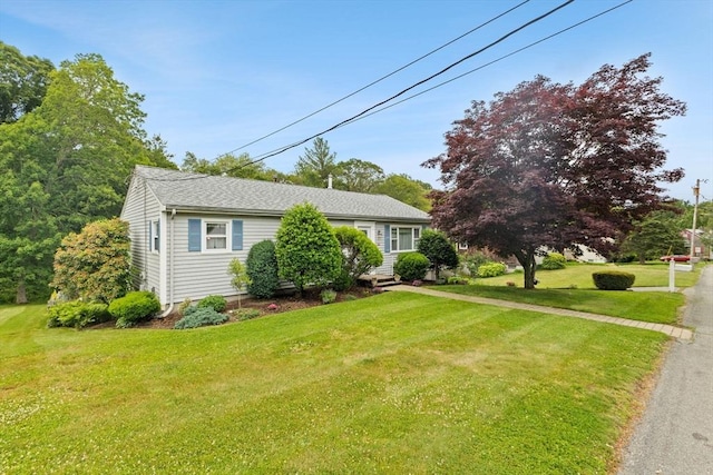 114 Cypress Dr, Swansea, MA 02777 - view of front of home featuring a front yard and a shingled roof
