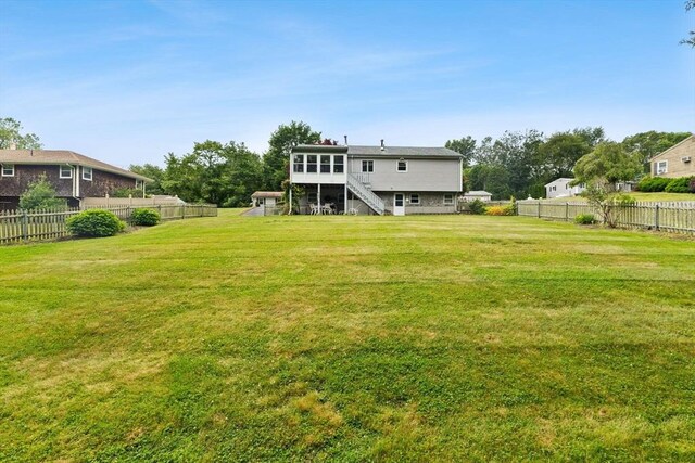 114 Cypress Dr, Swansea, MA 02777 - back of property featuring stairs and a fenced backyard