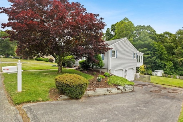 114 Cypress Dr, Swansea, MA 02777 - view of home's exterior featuring an attached garage and asphalt driveway