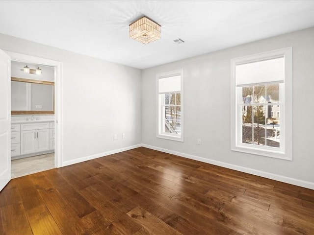 empty room with hardwood / wood-style flooring