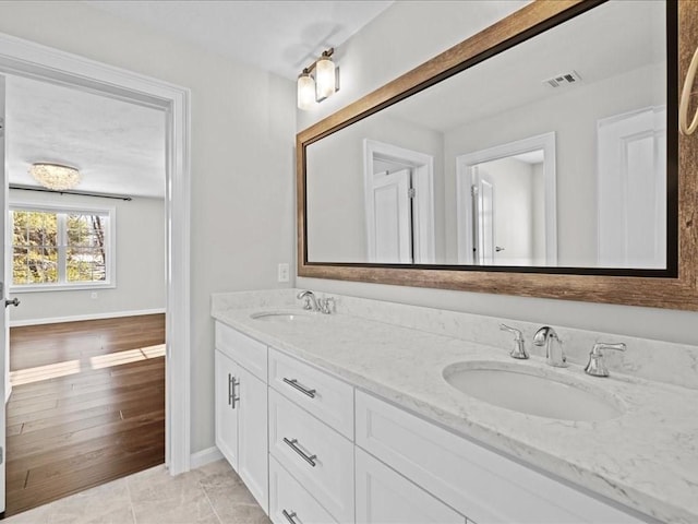 bathroom featuring hardwood / wood-style flooring and vanity