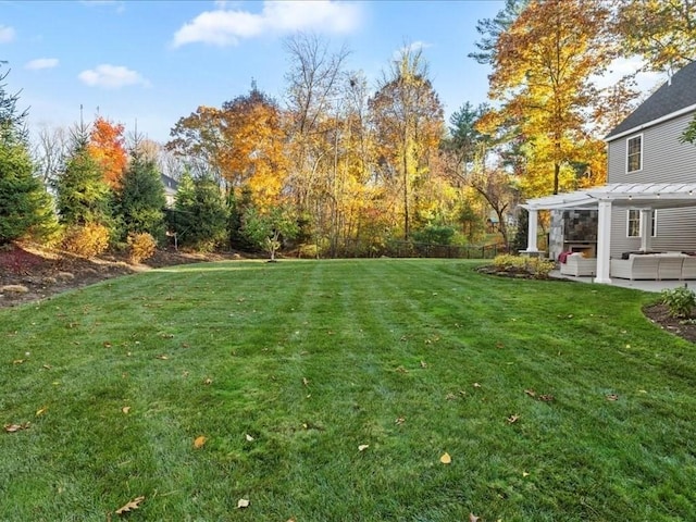 view of yard with a pergola and a patio