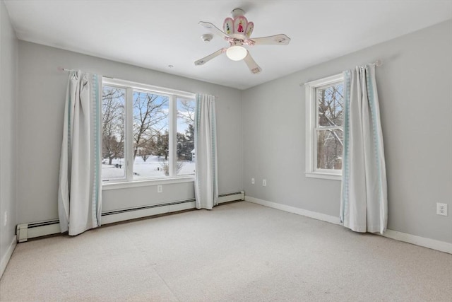 unfurnished room with a baseboard radiator, light carpet, and ceiling fan