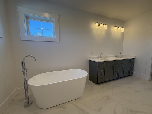 bathroom with a tub to relax in and vanity