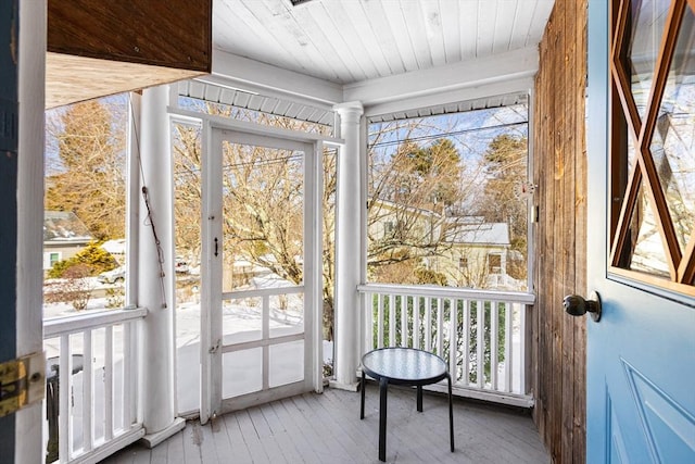 sunroom / solarium featuring wooden ceiling