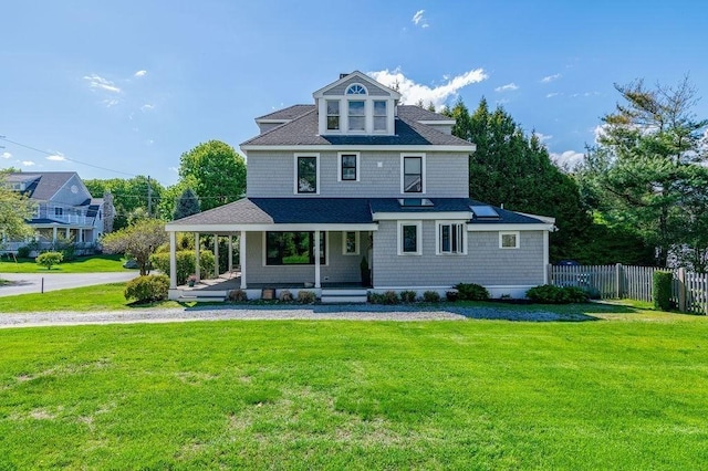 view of front of home with a porch and roof with shingles