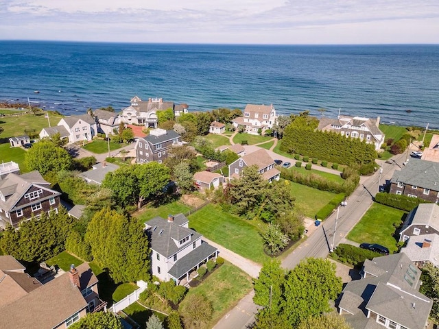 aerial perspective of suburban area with a nearby body of water