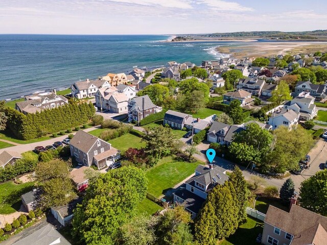 aerial view of residential area featuring a nearby body of water