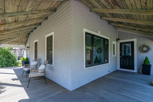 wooden deck featuring covered porch