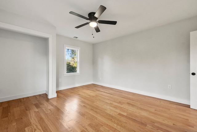 unfurnished room featuring ceiling fan and light hardwood / wood-style floors