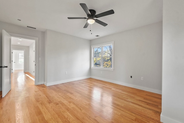 empty room featuring light hardwood / wood-style floors and ceiling fan