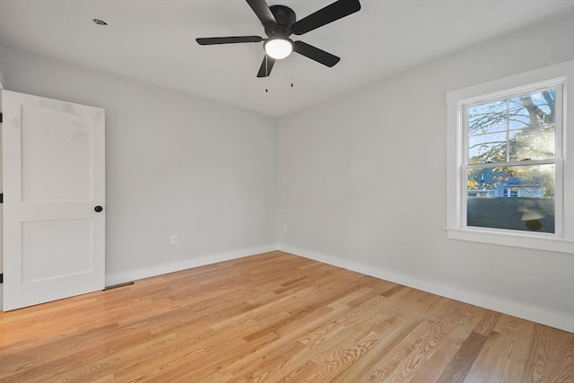 empty room featuring light hardwood / wood-style flooring and ceiling fan