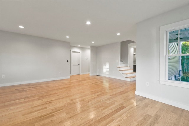 empty room with light hardwood / wood-style flooring