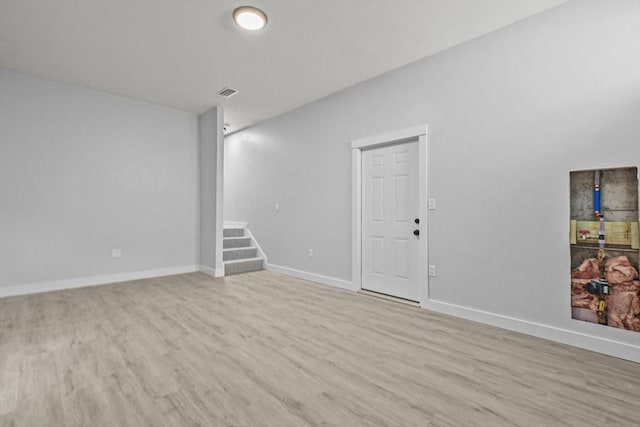 spare room featuring light wood-type flooring