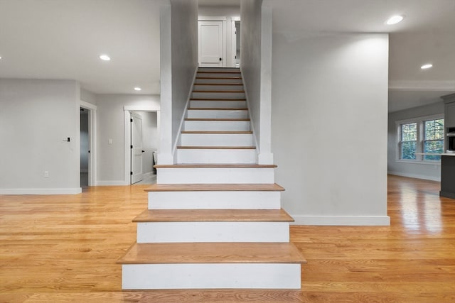 stairway featuring hardwood / wood-style floors