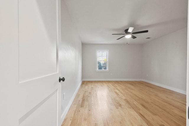 spare room featuring light hardwood / wood-style floors and ceiling fan