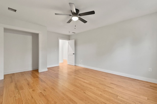 empty room featuring ceiling fan and light hardwood / wood-style floors