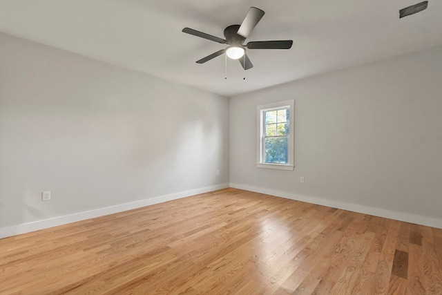 empty room featuring ceiling fan and light hardwood / wood-style flooring