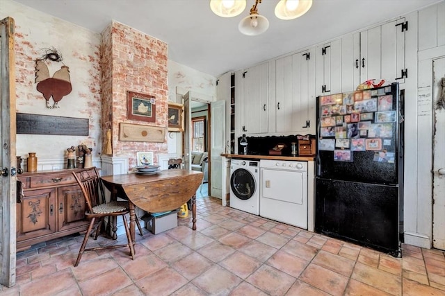 2241 Main St, Brewster, MA 02631 - kitchen with freestanding refrigerator, white cabinets, and independent washer and dryer