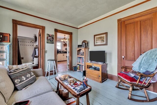 2241 Main St, Brewster, MA 02631 - living area featuring hardwood / wood-style flooring, crown molding, and baseboards