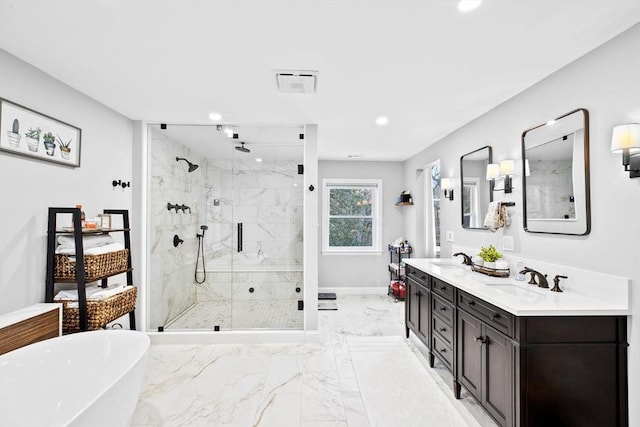 bathroom featuring vanity and shower with separate bathtub