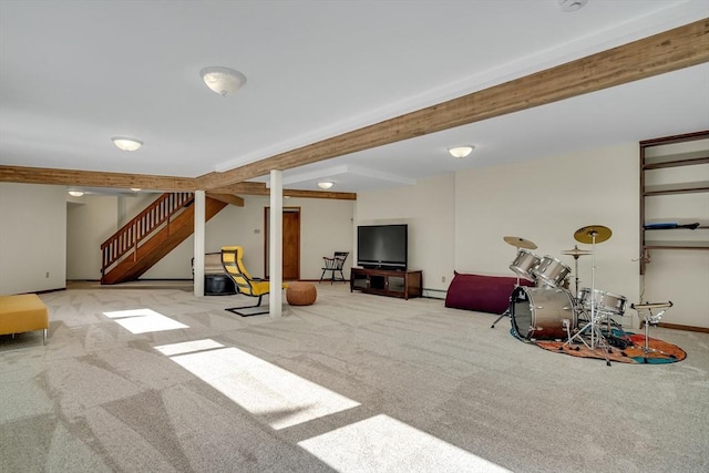 finished below grade area featuring baseboards, stairway, and carpet