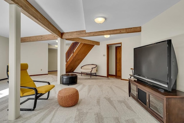 living area featuring carpet flooring, stairway, beam ceiling, and baseboards